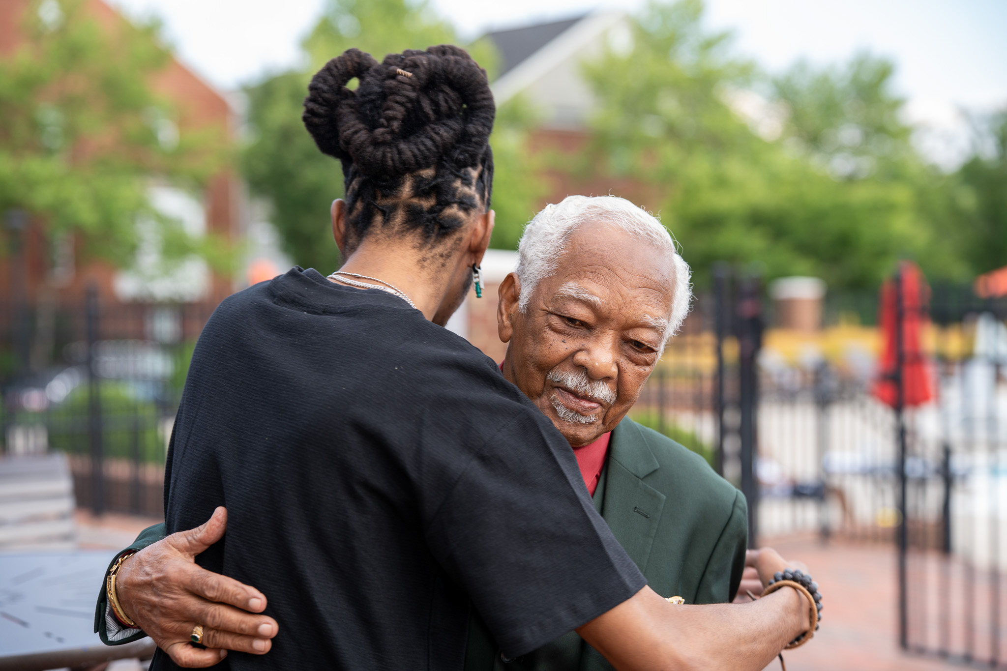 A guest hugging the guest of honor at a 90th birthday celebration in Richmond